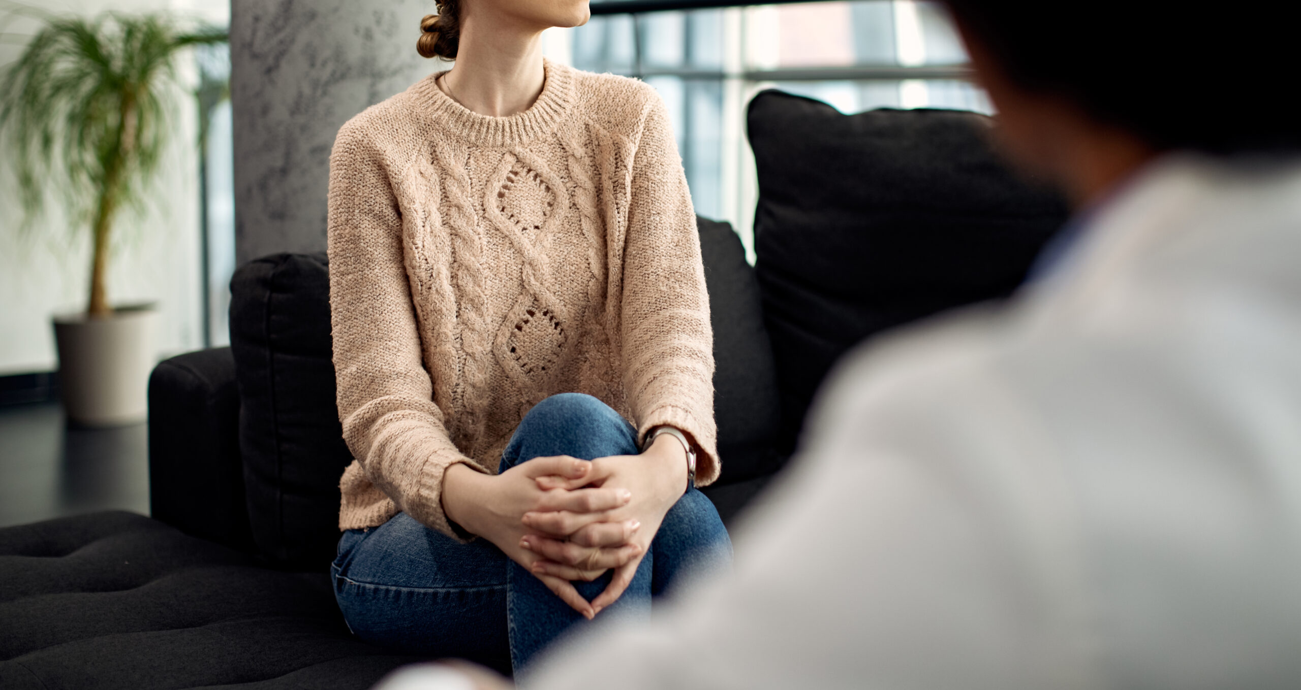 woman sitting getting psychotherapy for anorexia